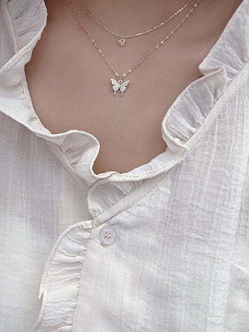 SHEIN Collar a capas con diamante de imitación con accesorio de mariposa - Quierox - Tienda Online