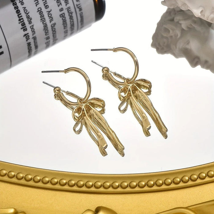 Shein Elegantes pendientes de borla con lazo dorado para mujer, diseño ligero y elegante - Quierox - Tienda Online