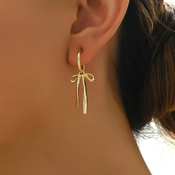 Shein Elegantes pendientes de borla con lazo dorado para mujer, diseño ligero y elegante - Quierox - Tienda Online