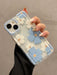 SHEIN Funda de TPU a prueba de golpes con estampado de flores blancas y azules para iPhone 15 - Quierox - Tienda Online