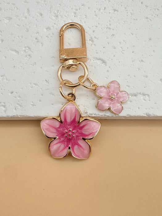 SHEIN HAILIAN 1 pieza Llavero con colgante en forma de flor de sakura de aleación ligera - Quierox - Tienda Online