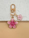 SHEIN HAILIAN 1 pieza Llavero con colgante en forma de flor de sakura de aleación ligera - Quierox - Tienda Online