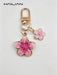 SHEIN HAILIAN 1 pieza Llavero con colgante en forma de flor de sakura de aleación ligera - Quierox - Tienda Online