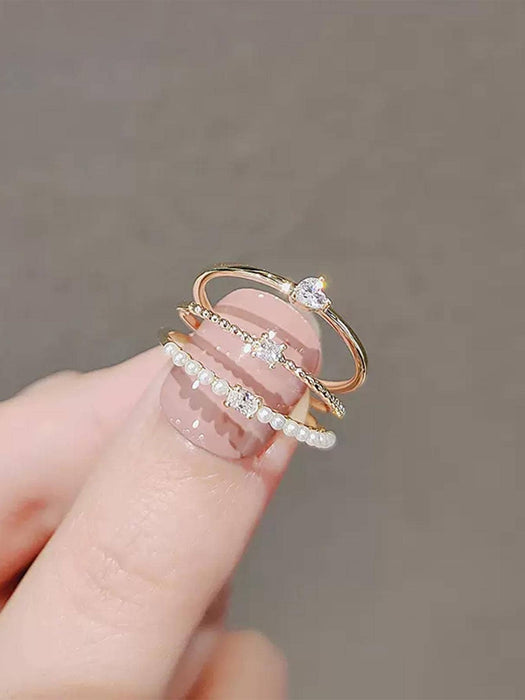 SHEIN Juego de anillos diseño de corazón y perla artificial