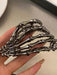 SHEIN Pinza para el cabello con forma de garra de esqueleto de terror - Quierox - Tienda Online