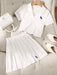 SHEIN Set de 2 piezas: Camisa tipo polo casual y deportiva + Falda plisada - Quierox - Tienda Online
