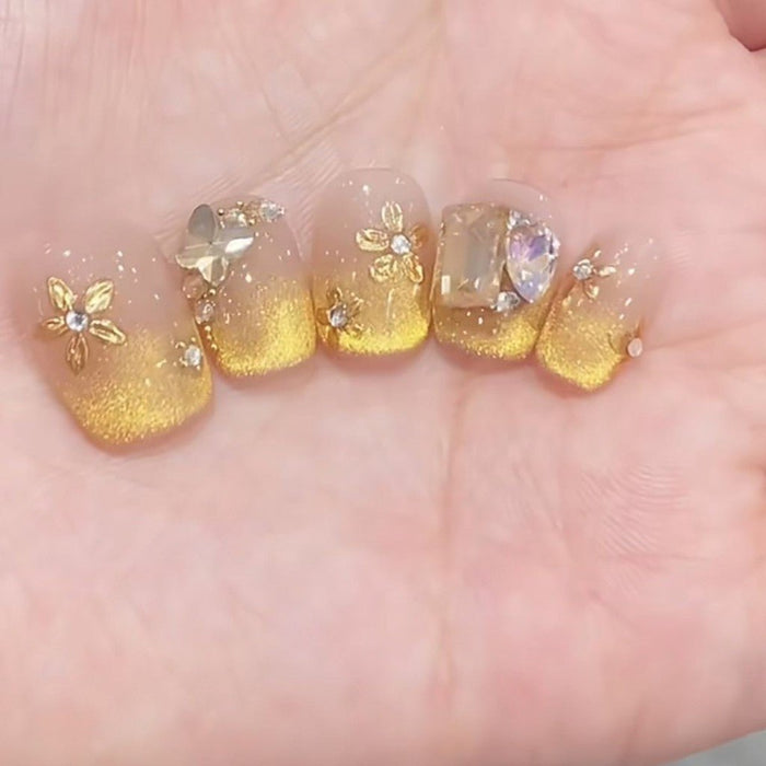 Uñas postizas press on hechas a mano con diseño de ojo de gato y flor dorada - Quierox - Tienda Online