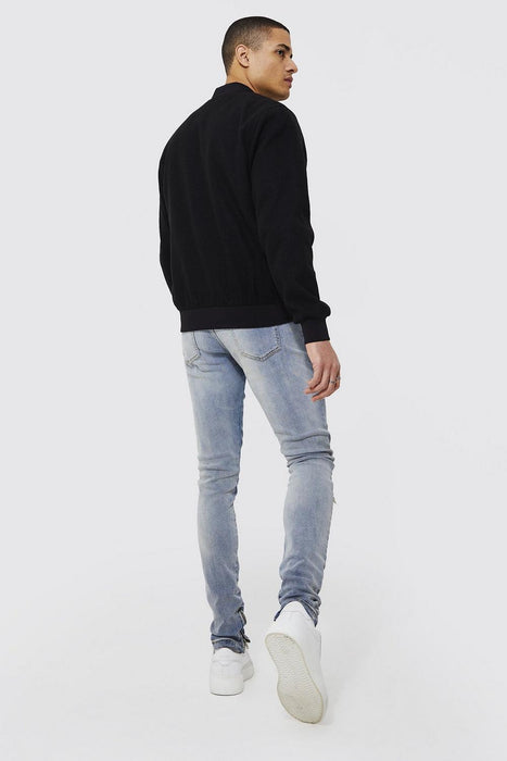 VAQUEROS AJUSTADOS CON RODILLAS ROTAS Y APILADAS - Quierox - Tienda Online