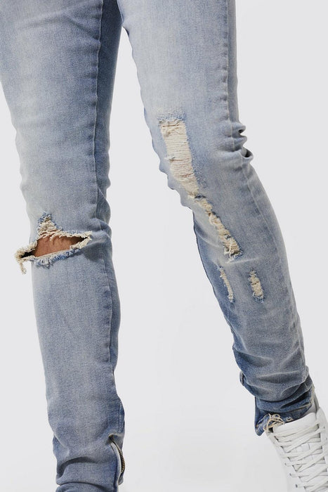 VAQUEROS AJUSTADOS CON RODILLAS ROTAS Y APILADAS - Quierox - Tienda Online